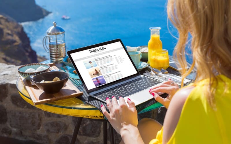 woman working on her laptop during a vacation